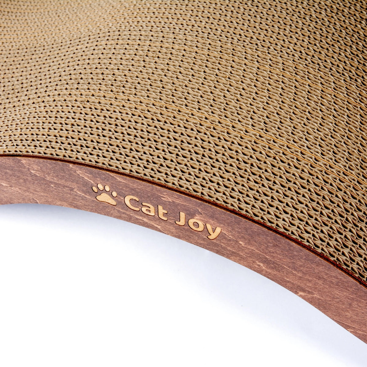 Close-up of the brown wooden facade with the engraved CAT JOY paw